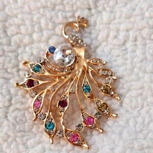 Elegant Gold Peacock Brooch with Multicolor Crystals
